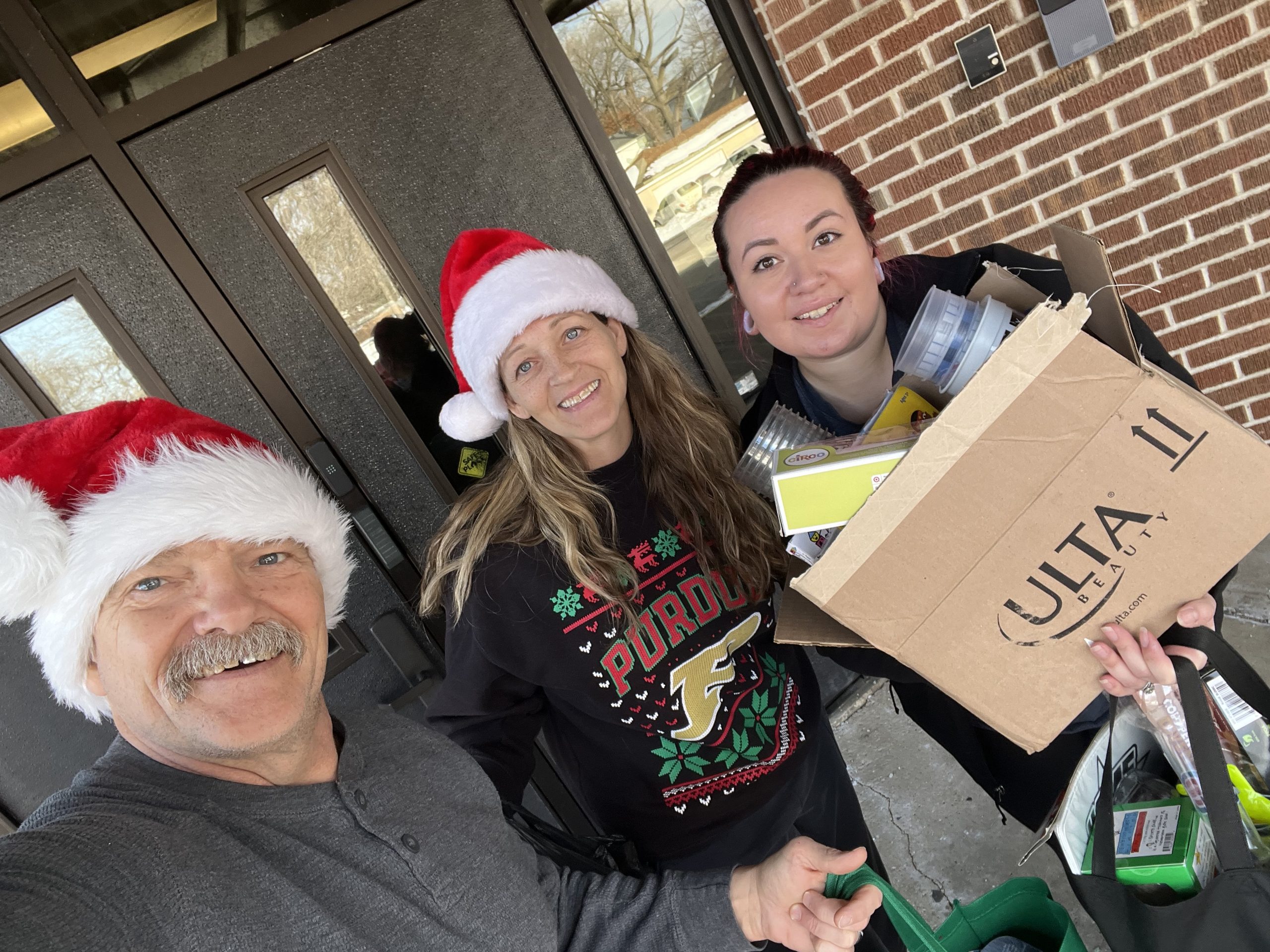 Larry Larmon and the Sterling Foundation Team helping with the food drive
